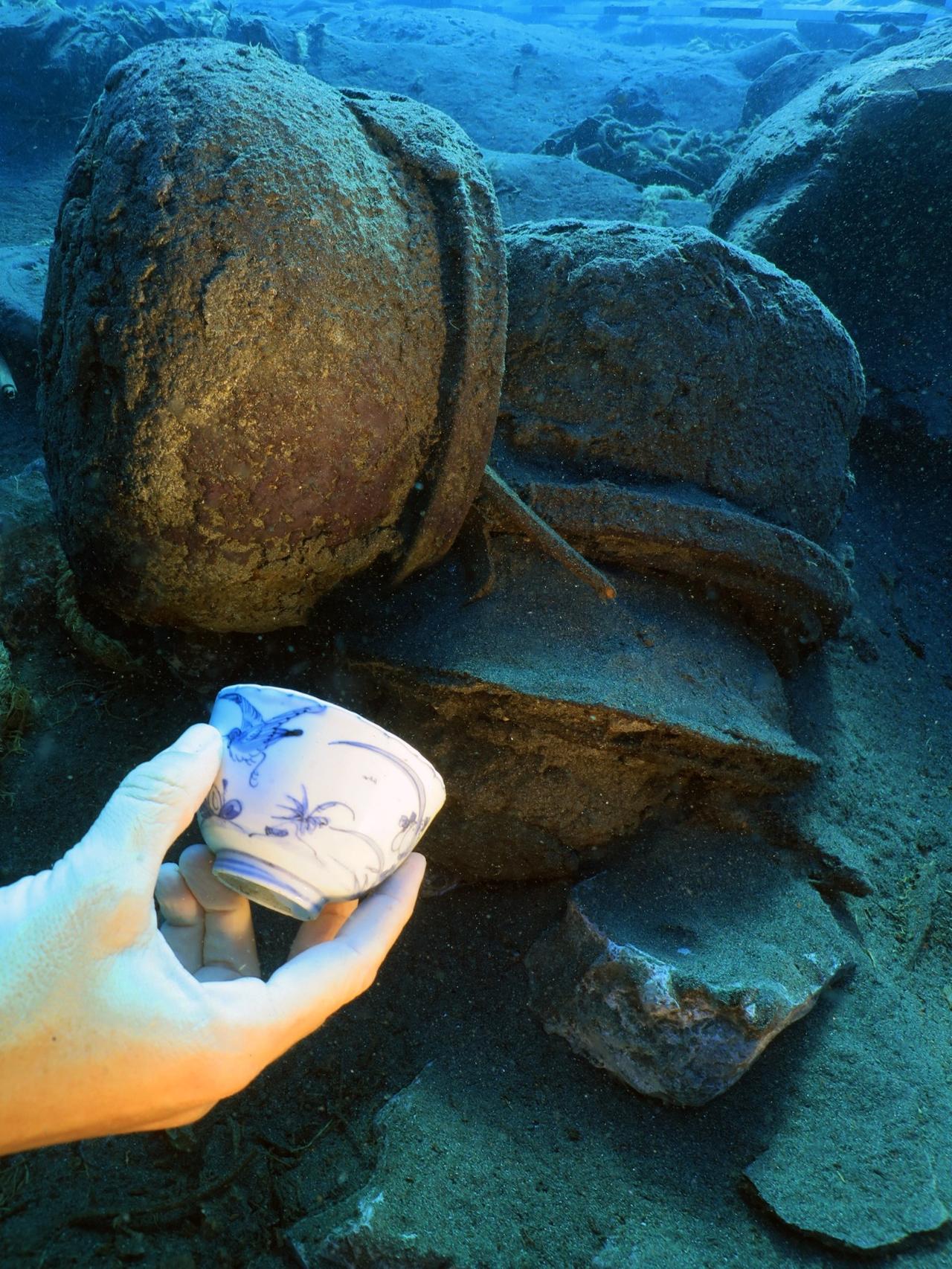 A piece of Chinese porcelain recovered from the 17th-century Ottoman shipwreck during underwater excavations in the Mediterranean, August 24, 2025. (AA Photo)