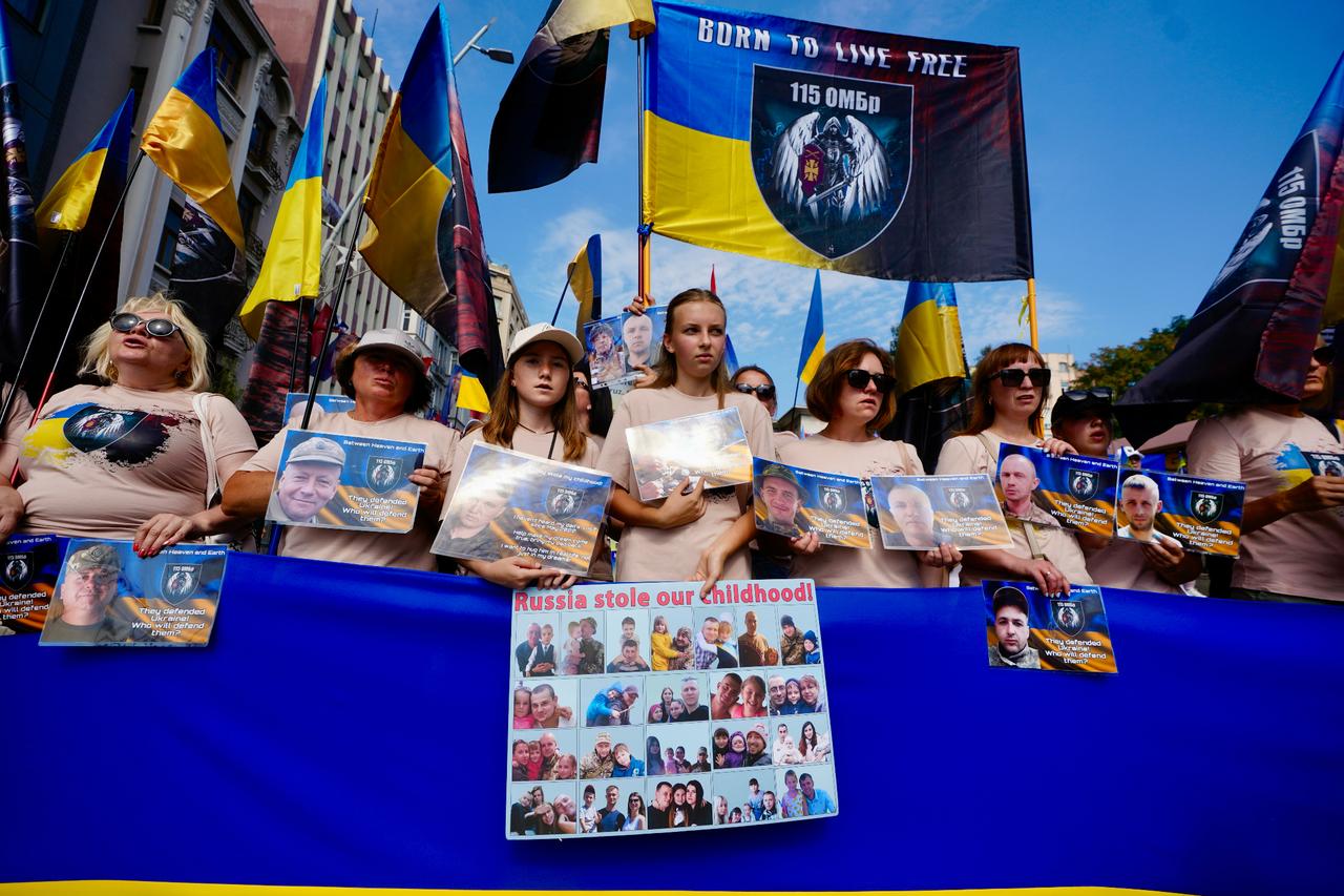 Ukrainians, living in Istanbul, hold portraits of captured soldiers and display banners during a demonstration calling for the release of prisoners of war, as they gather in Beyoglu district, in Istanbul, Türkiye, August 23, 2025. (AA Photo)