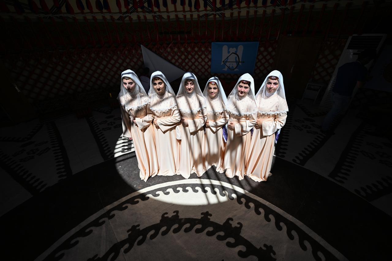 Women wearing traditional clothes pose for a photo as part of the 954th Manzikert (Malazgirt) Victory celebration in Ahlat district of Bitlis, Türkiye, Aug. 23, 2025. (AA Photo)