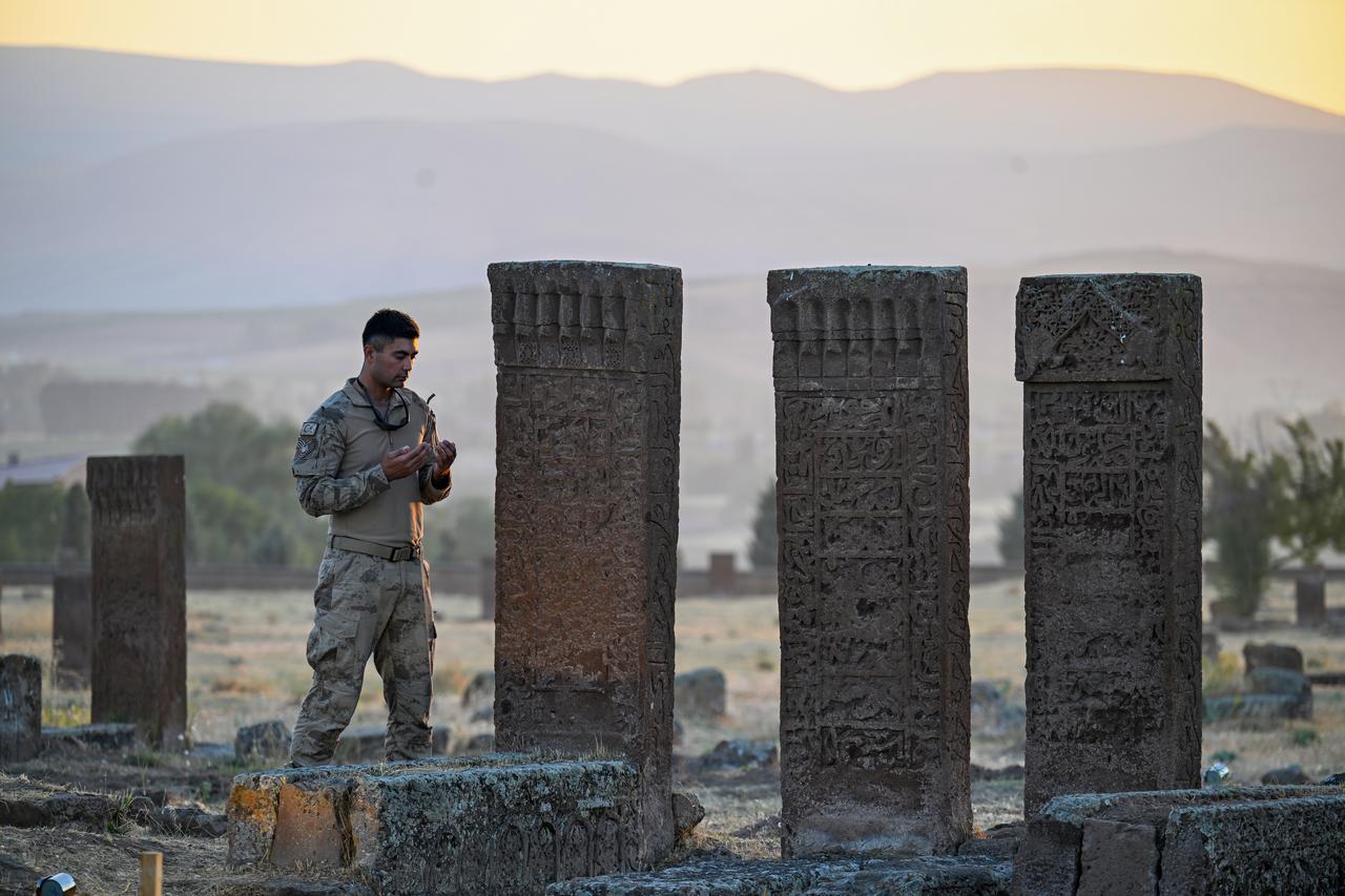 Visitors from across the country visit Seljuk Square Cemetery, listed on the UNESCO World Cultural Heritage Tentative List, to commemorate the 954th anniversary of the Manzikert (Malazgirt) Victory in the Ahlat district of Bitlis, Türkiye, Aug. 24, 2025. (AA Photo)