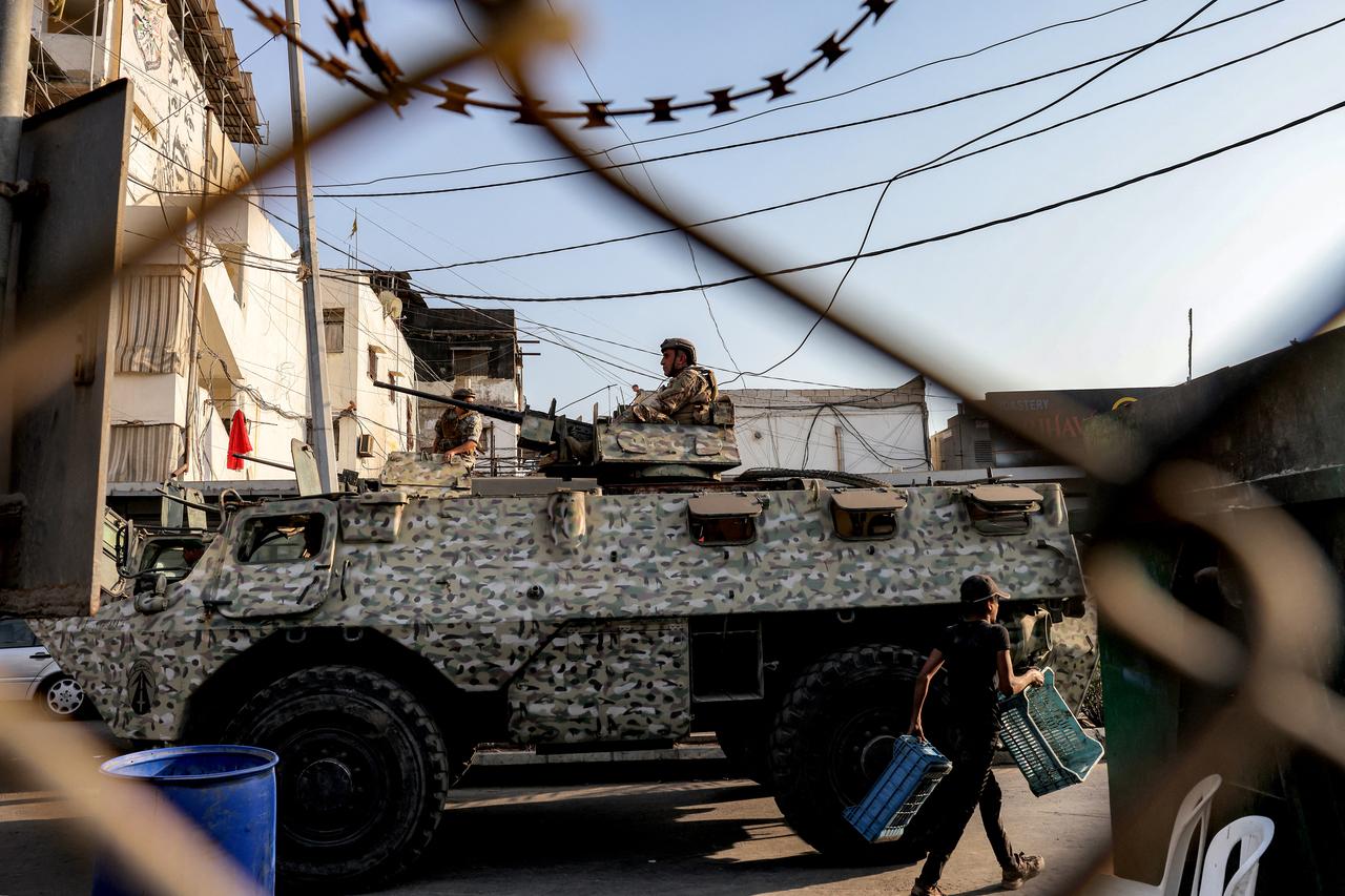 A Lebanese army soldier mans a turret atop an armoured personnel carrier stationed at the Burj al-Barajneh camp for Palestinian refugees in Beirut's southern suburbs on August 21, 2025. (AFP Photo)