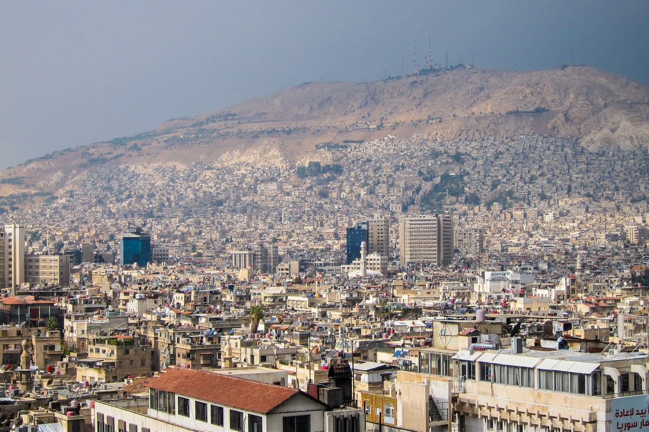 Aerial view with residential buildings and Mount Qasioun in the background in Damascus, Syria, November 3, 2019. (Adobe Stock Photo)