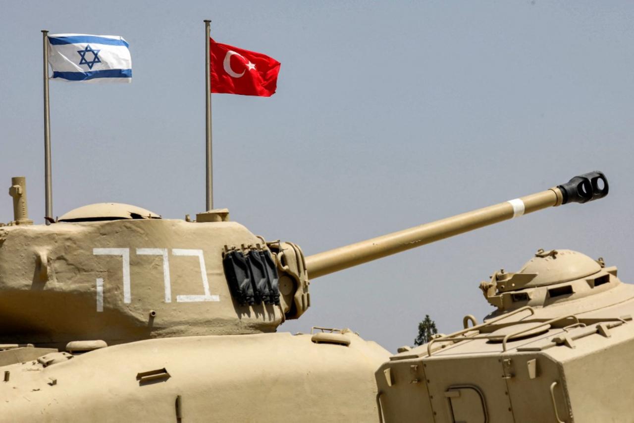 The flags of (L to R) Israel and Türkiye fly behind M4A1 Sherman and AMX-13 battle tanks on display in Latrun, about 30 km west of Jerusalem, August 18, 2022. (AFP Photo)