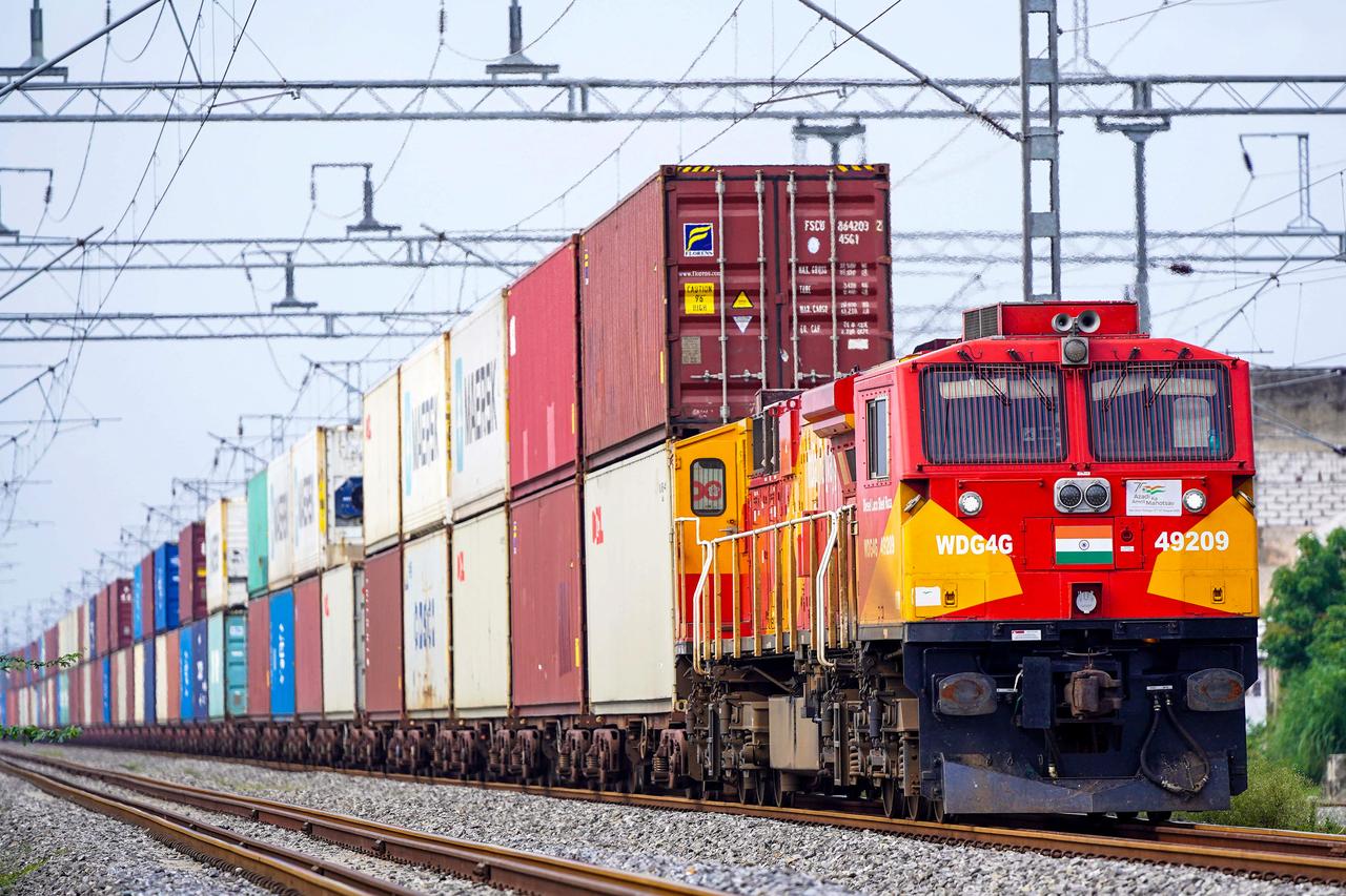 A freight train carrying cargo containers rides along a railway track in Ajmer on August 26, 2025. (AFP Photo)