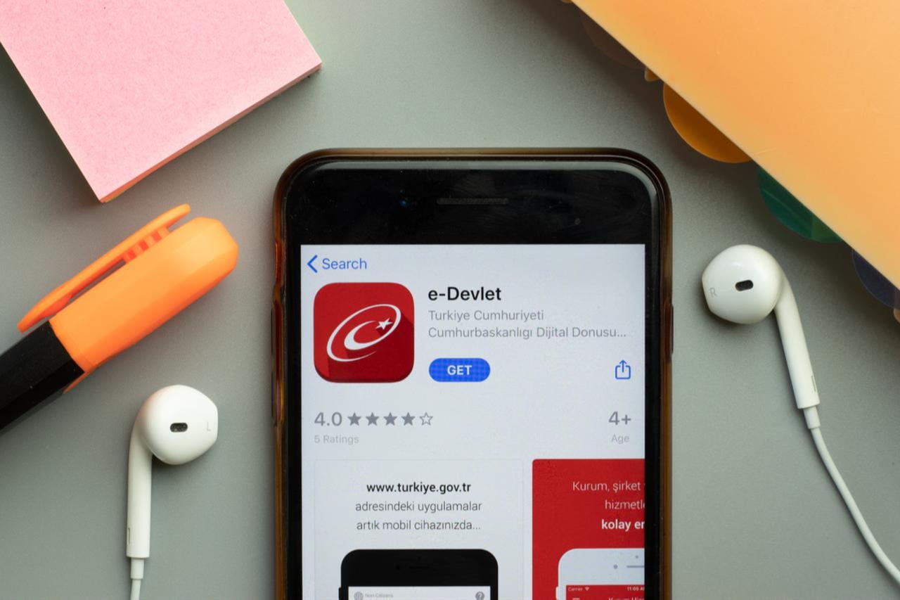 A smartphone displays the e-Devlet (e-Government) application, Türkiye’s official digital portal for accessing public services. (Adobe Stock Photo)
