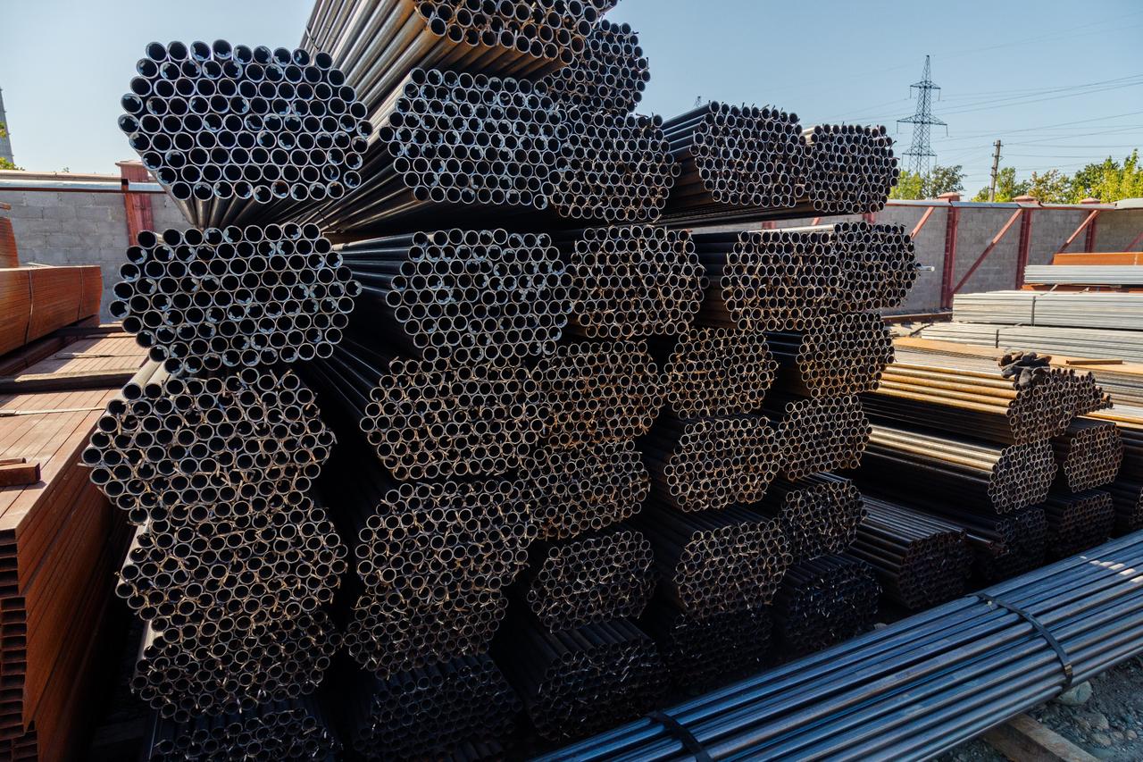 Stacks of galvanized steel pipes stored at a facility. (Adobe Stock Photo)