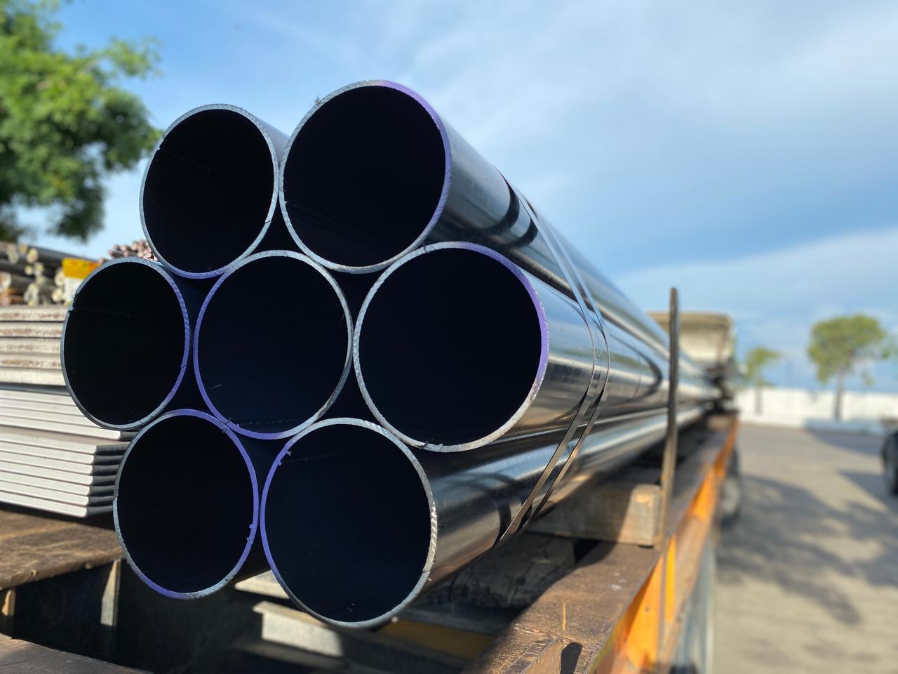 Steel pipes prepared for shipment at an industrial site. (Adobe Stock Photo)