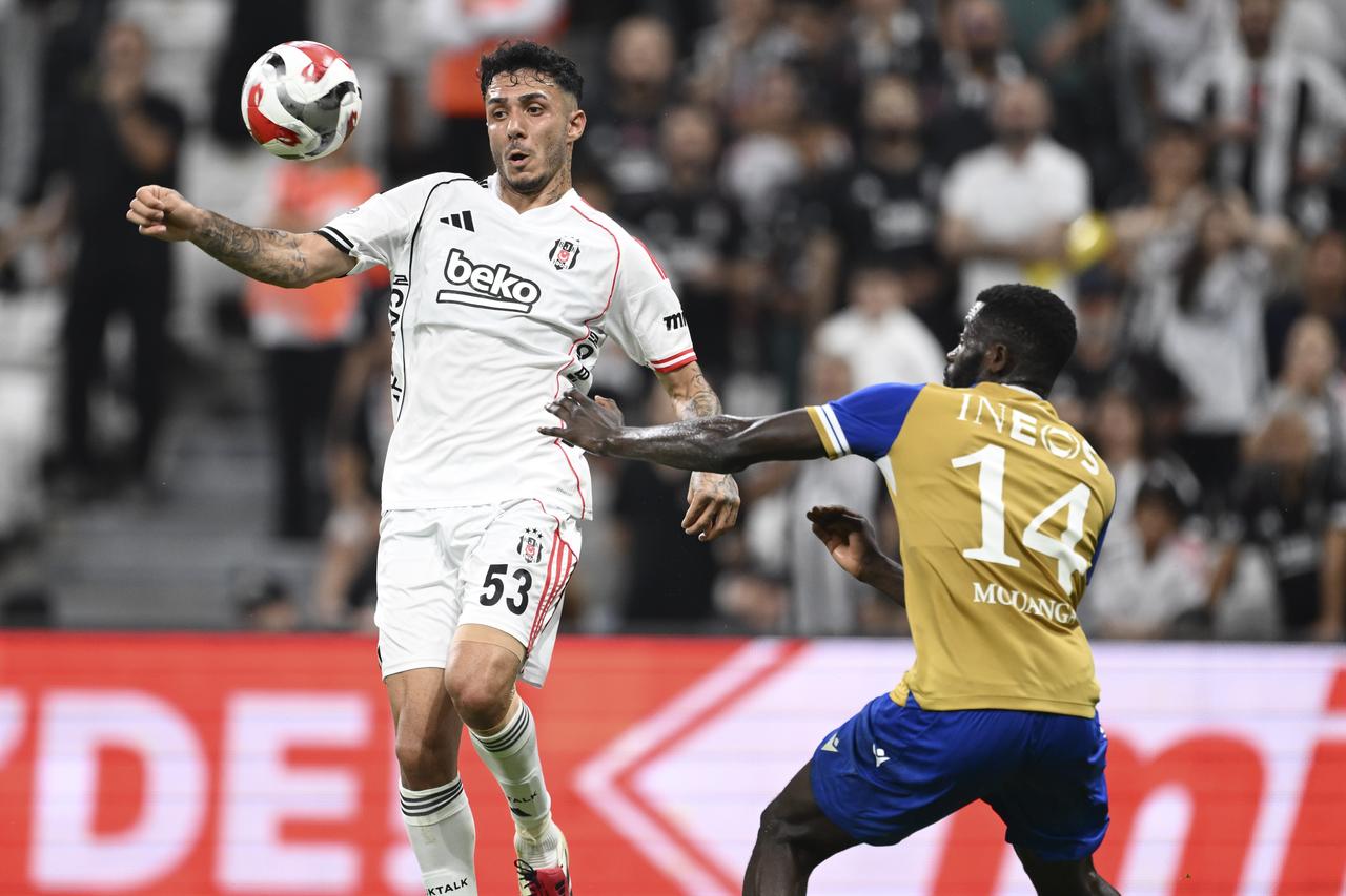 Emirhan Topcu (53) of Besiktas in action against Kevin Mouanga (14) of Lausanne during the UEFA Conference League play-off second leg match between Besiktas and Lausanne at Tupras Stadium in Istanbul, Türkiye, on August 28, 2025.(AA Photo)