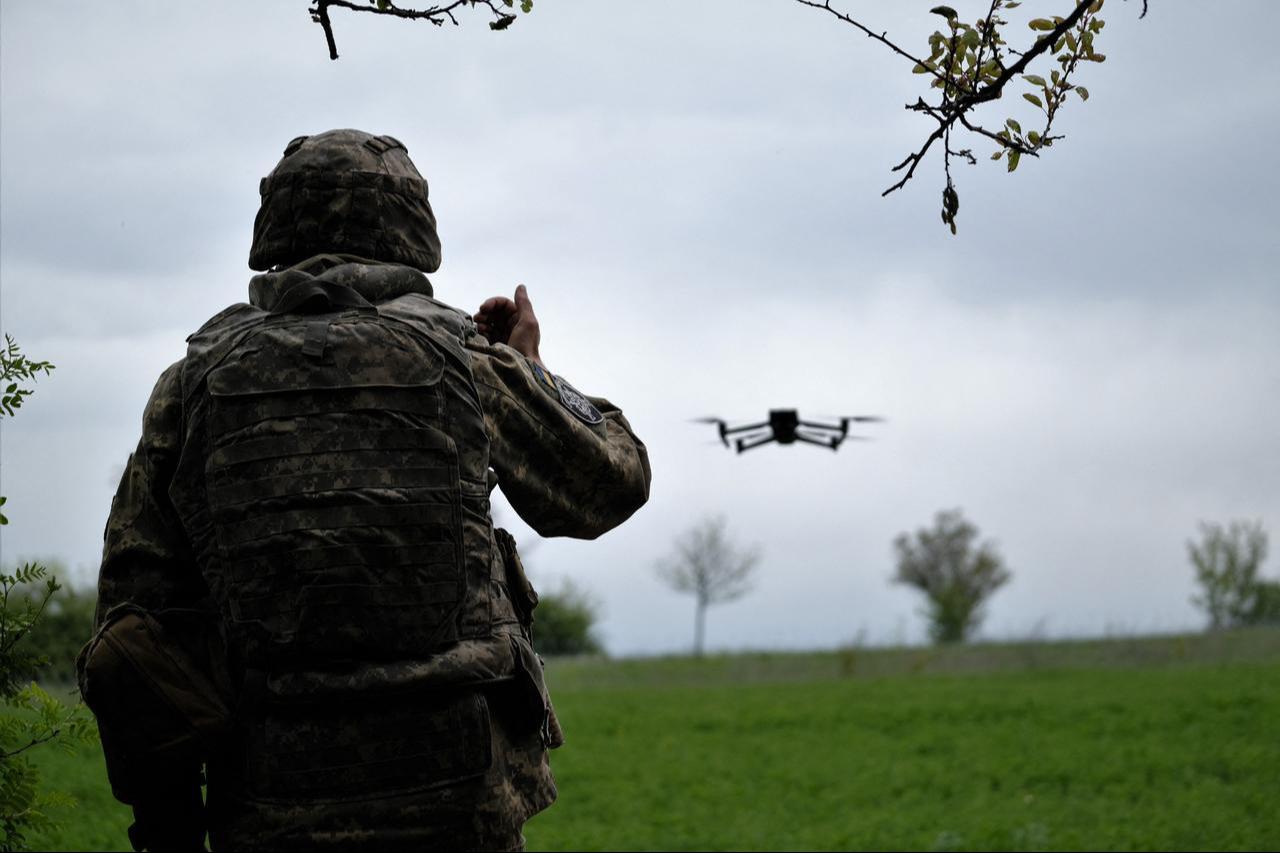 A Ukrainian serviceman of a reconnaissance team flies a drone at a front line near the town of Bakhmut, Donetsk region on May 8, 2023. (AFP Photo)