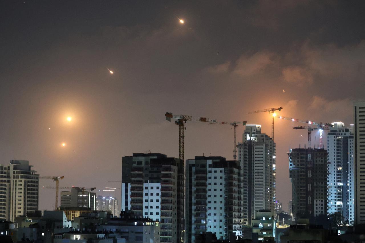 This picture shows rocket trails in the sky above Netanya, Israel on June 13, 2025. (AFP Photo)