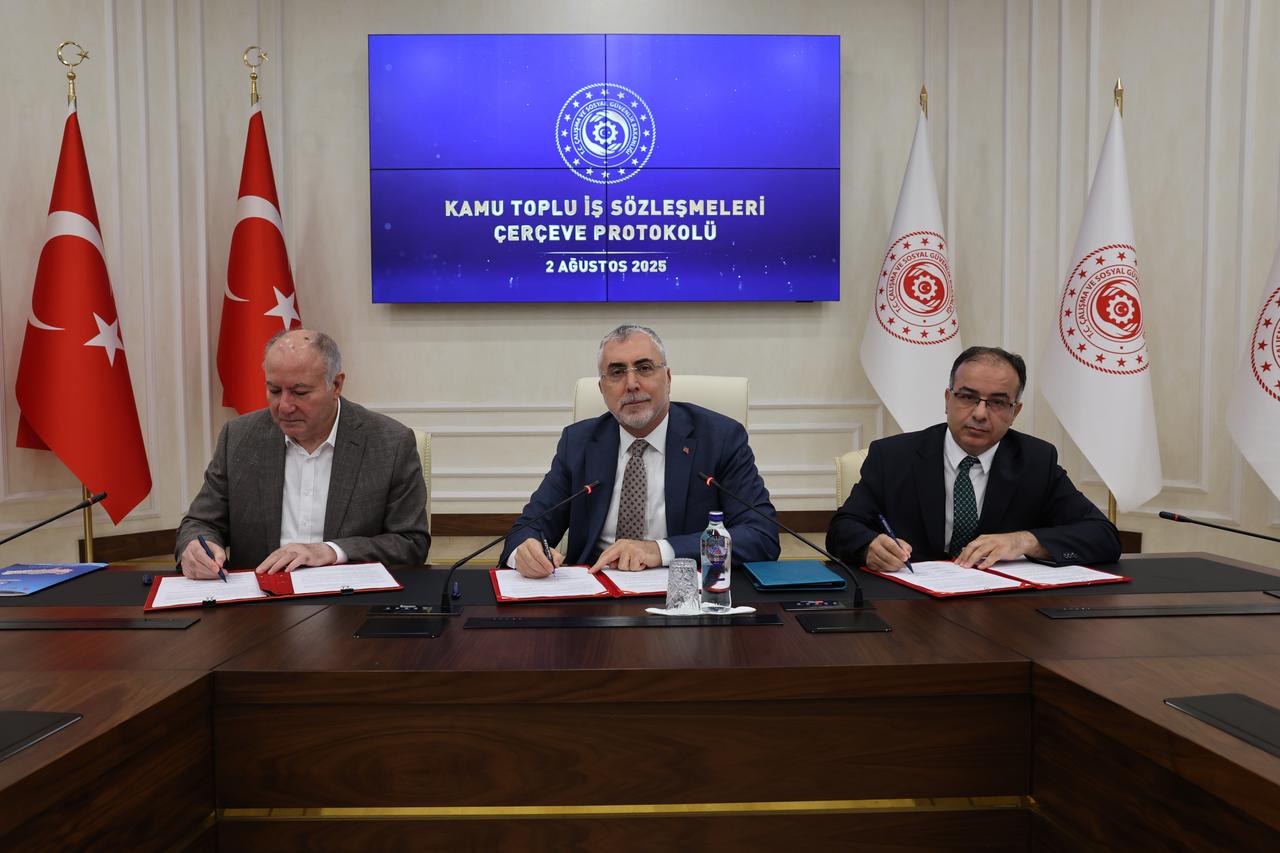 Labor Minister Vedat Isikhan (center) poses with union representatives after signing the 2025–2026 Public Collective Labor Agreement Framework Protocol in Ankara, Türkiye, August 2, 2025. (AA Photo)