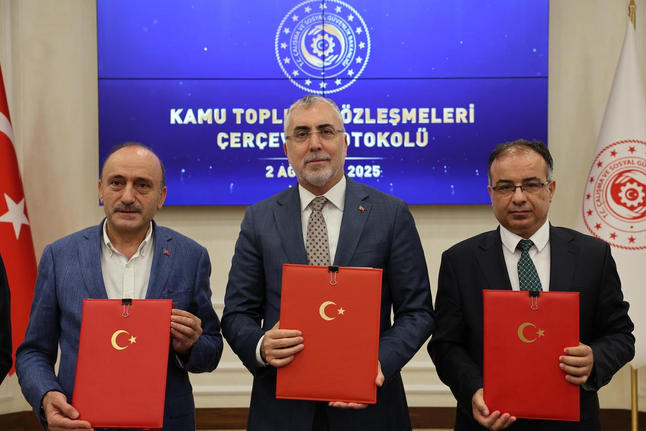 Labor Minister Vedat Isikhan (center) poses with union representatives after signing the 2025–2026 Public Collective Labor Agreement Framework Protocol in Ankara, Türkiye, August 2, 2025. (AA Photo)
