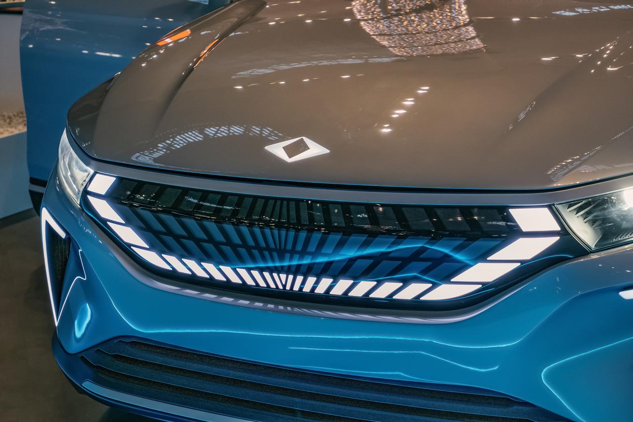 Close-up of glowing TOGG electric car logo on sleek hood at night in Istanbul, Türkiye on December 7, 2022. (Adobe Stock Photo)