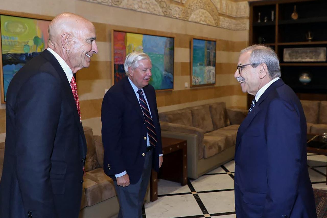 US ambassador to Türkiye and special envoy to Syria Tom Barrack (L) and US Senator Lindsey Graham (C) being welcomed by Lebanon's Prime Minister Nawaf Salam, in Beirut, on August 26, 2025. (AFP Photo)