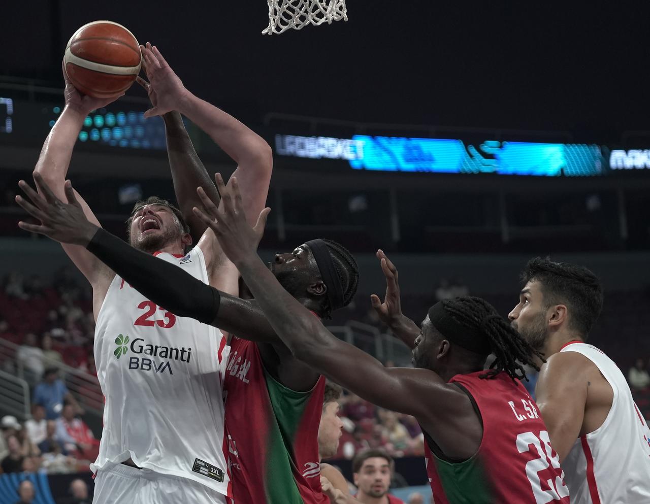 Alperen Sengun (23) of Türkiye in action against Neemias Queta of Portugal during the FIBA EuroBasket 2025 Group A basketball match between Türkiye and Portugal in Riga, Latvia on August 30, 2025. (AA Photo)