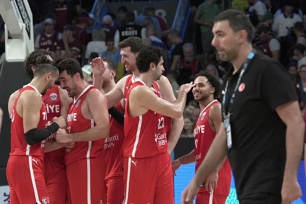 Players of Türkiye celebrate victory at the end of the FIBA EuroBasket 2025 Group A 1st week match between Latvia and Türkiye, Riga, Latvia, August 27, 2025. (AA Photo)