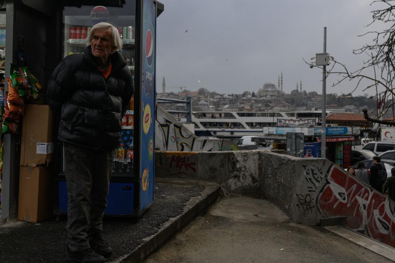 A vendor waits for customers at his stall near the Galata Bridge in Istanbul, March 28, 2025. (AFP Photo)