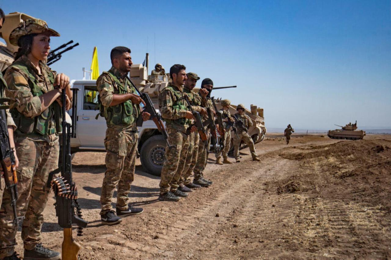 Members of the terrorist group PKK/YPG-led SDF attend a joint military exercise with forces of the US-led  Combined Joint Task Force-Operation Inherent Resolve  coalition in Syrias northeastern al-Hasakah province, September 7, 2022. (AFP Photo)