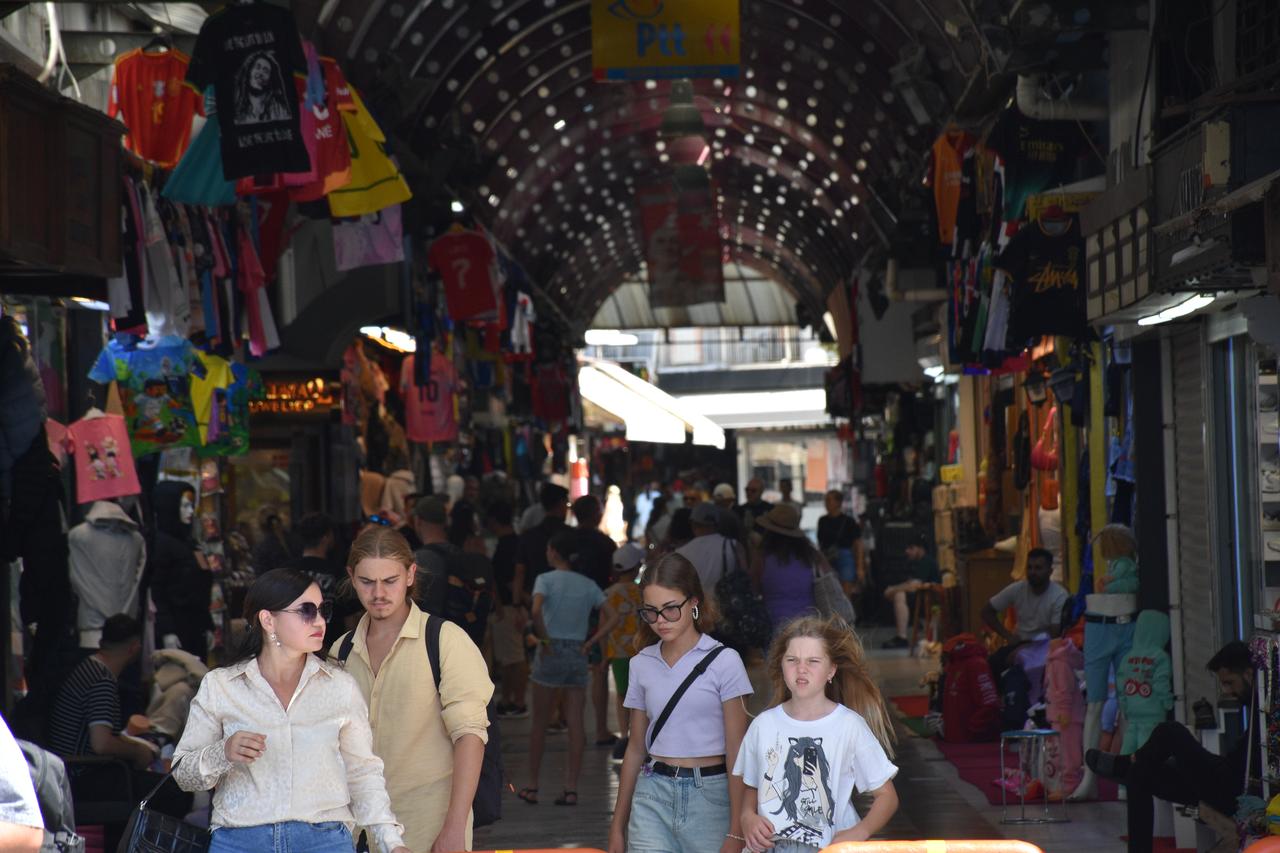 Tourists walk through the historic bazaar in Marmaris after disembarking from the Aroya cruise ship, which arrived with 2,684 passengers, Mugla, Türkiye, August 31, 2025. (AA Photo)