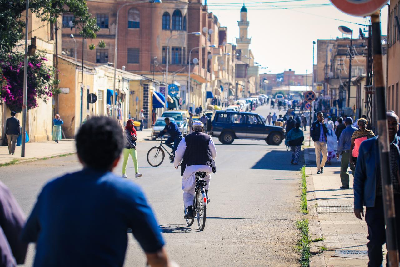 Yellow taxi and other cars on the central street of Asmara, Eritrea, November 02, 2019 , (Photo by Adobe Stock)