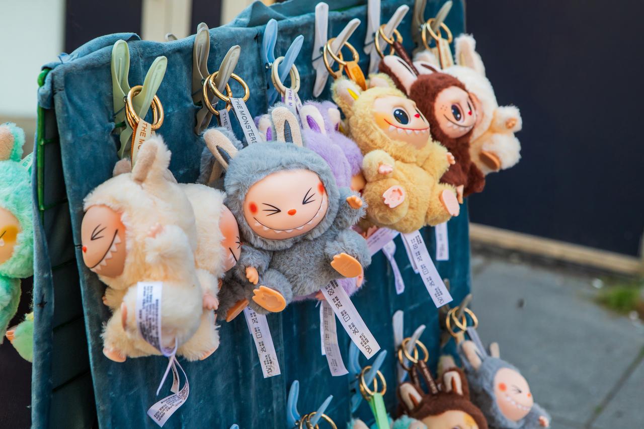 An assortment of Labubu plush keychains displayed on a street stall, accessed August 5, 2025. (Adobe Stock Photo)