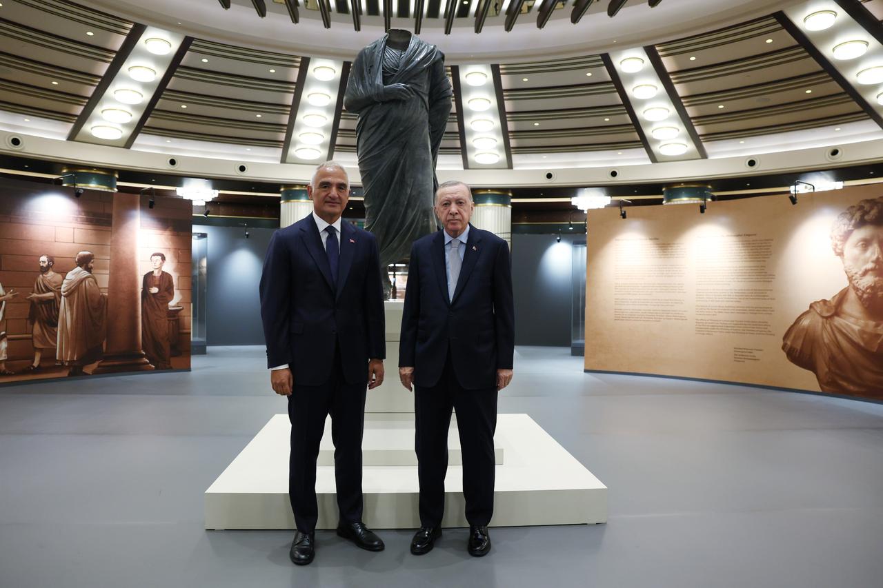 President Erdogan posed for a photo with Minister of Culture and Tourism Mehmet Nuri Ersoy in front of the Marcus Aurelius statue, which was brought from abroad and displayed at Golden Age of Archaeology Exhibition at the Presidential Nations Library in Ankara, Türkiye, August 6, 2025. (AA Photo)