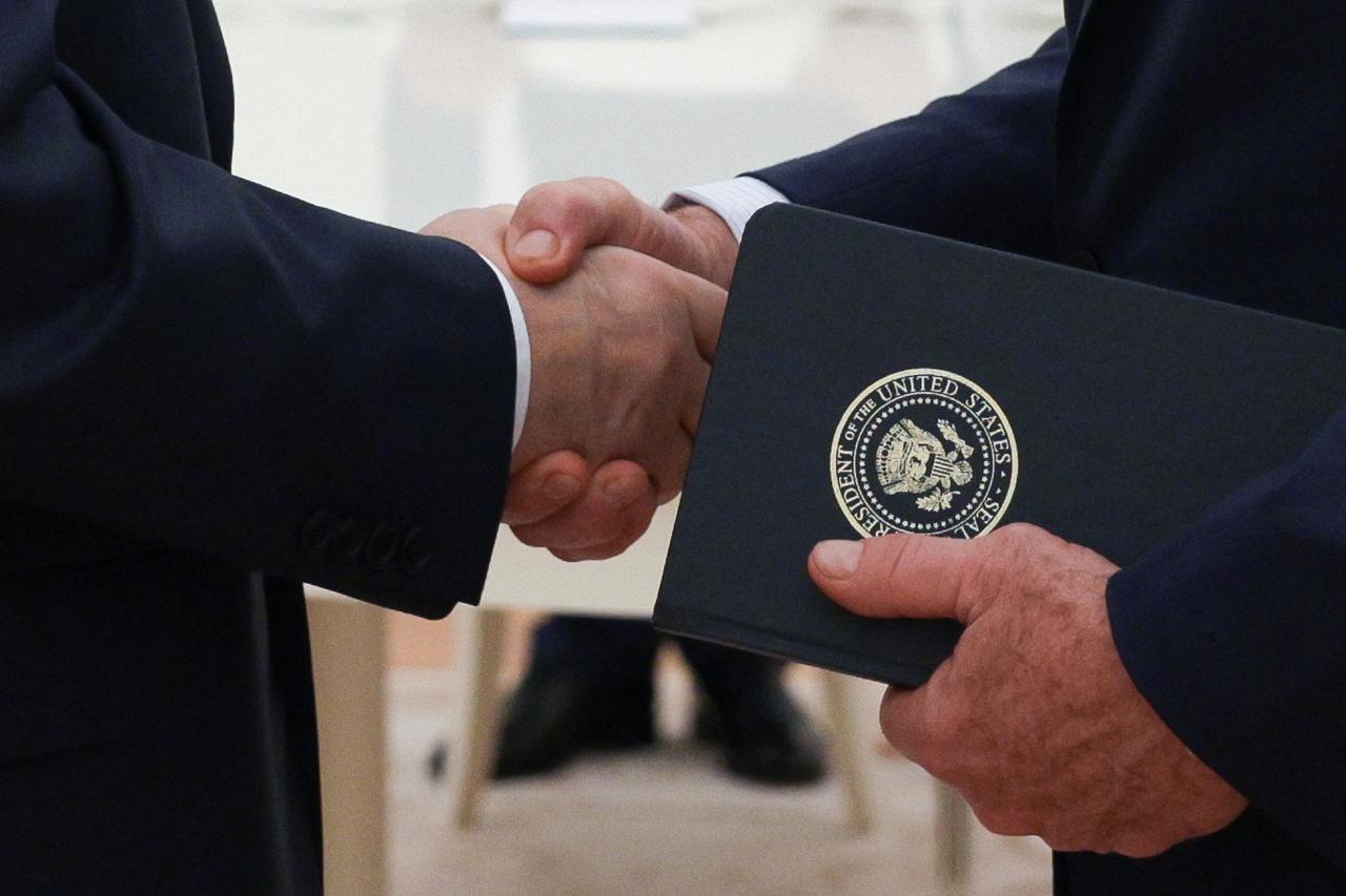 In this pool photograph distributed by the Russian state agency Sputnik, Russia's President Vladimir Putin greets U.S. Special Envoy Steve Witkoff prior to their talks in Moscow on August 6, 2025. (AFP Photo)