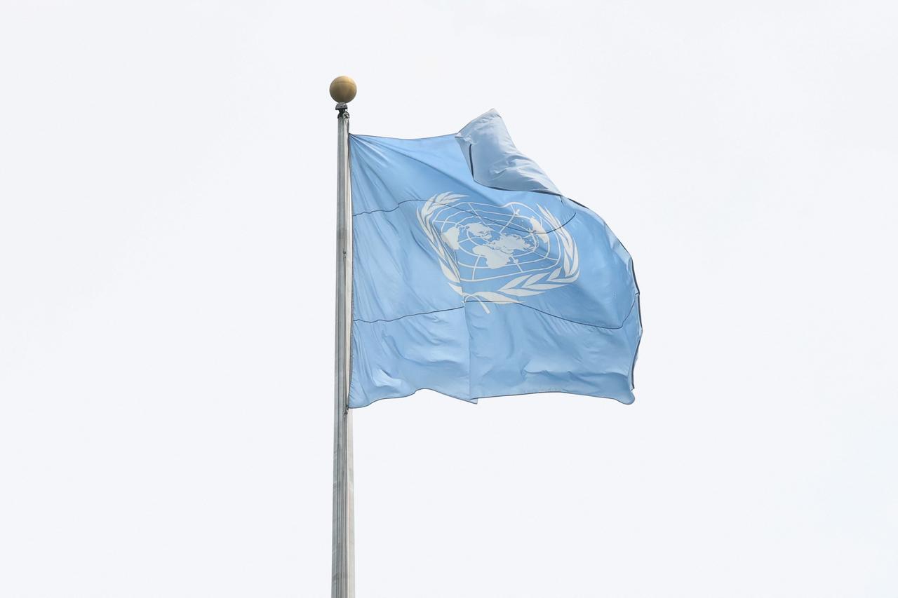 The United Nations flag flaps in the wind at the headquarters on August 05, 2025 in New York City. (AFP Photo)