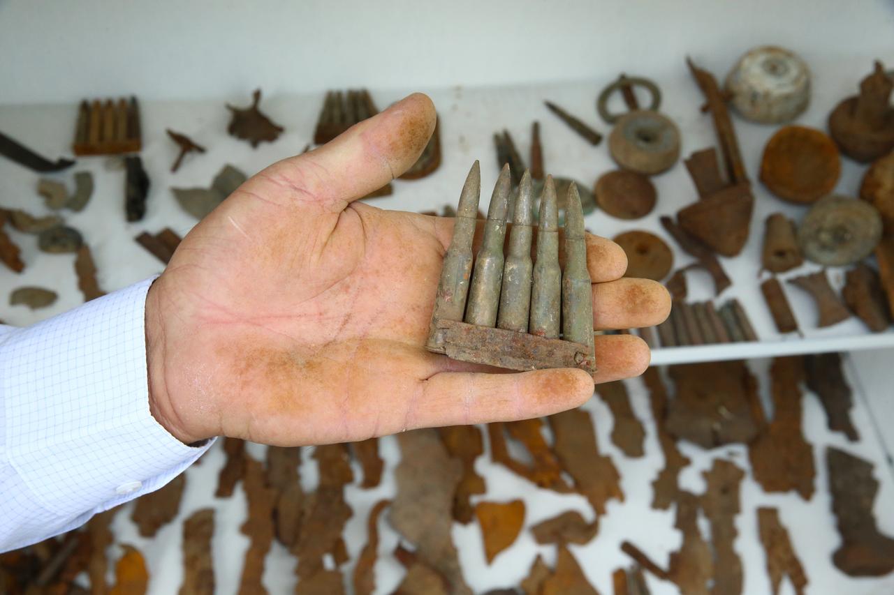 64-year-old Abdullah Kus displays a collection of ammunition and war relics he found from the Ottoman-Russian War of 1916–1917, including bullets, shrapnel, and horseshoes, which he has gathered over the years in Bingol, Türkiye, August 4, 2025. (AA Photo)