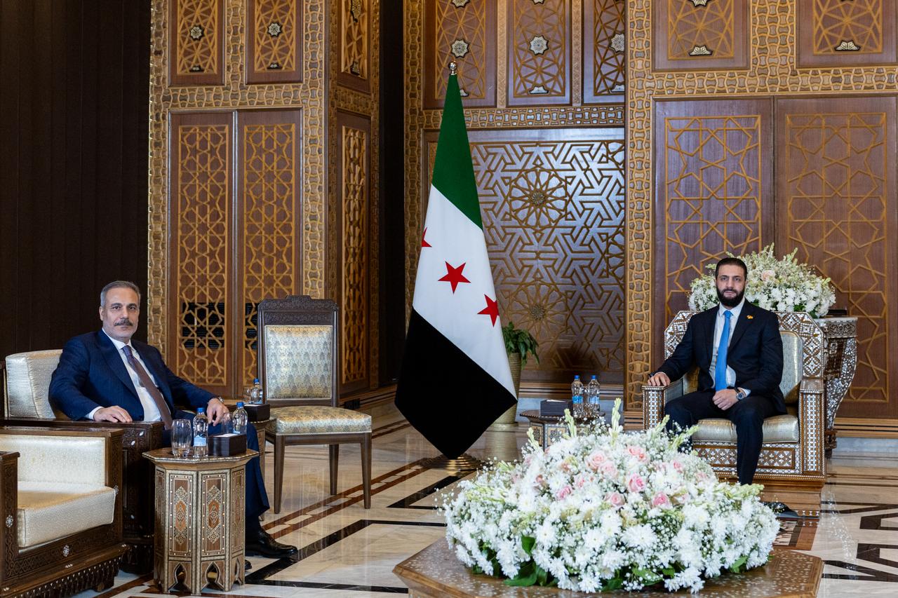 Turkish Foreign Minister Hakan Fidan (L) is received by Syrian President Ahmad al-Sharaa (R) in Damascus, Syria on August 07, 2025. (AA Photo)