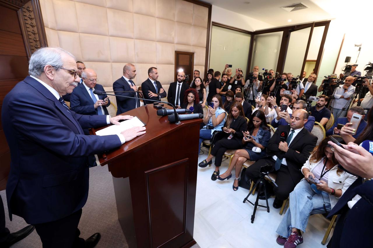 Lebanese Prime Minister Nawaf Salam (L) speaks during a press conference following the cabinet meeting to discuss the issue of the state monopoly on weapons in the capital Beirut, Lebanon on August 5, 2025. (Lebanese Presidency / AA Photo)
