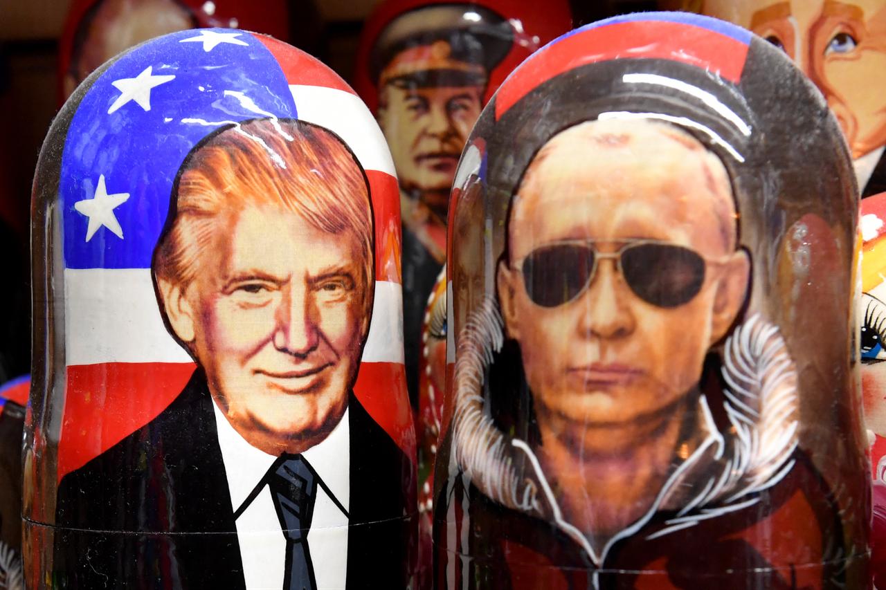 Traditional Russian wooden nesting dolls, Matryoshka dolls, depicting Russias President Vladimir Putin and US President Donald Trump are displayed for sale in Saint Petersburg on August 7, 2025. (AFP Photo)