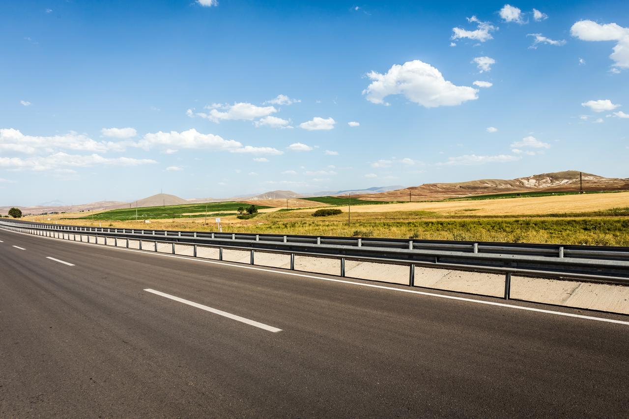 A view of a newly constructed highway cutting through rural landscape in central Türkiye. (Adobe Stock Photo)