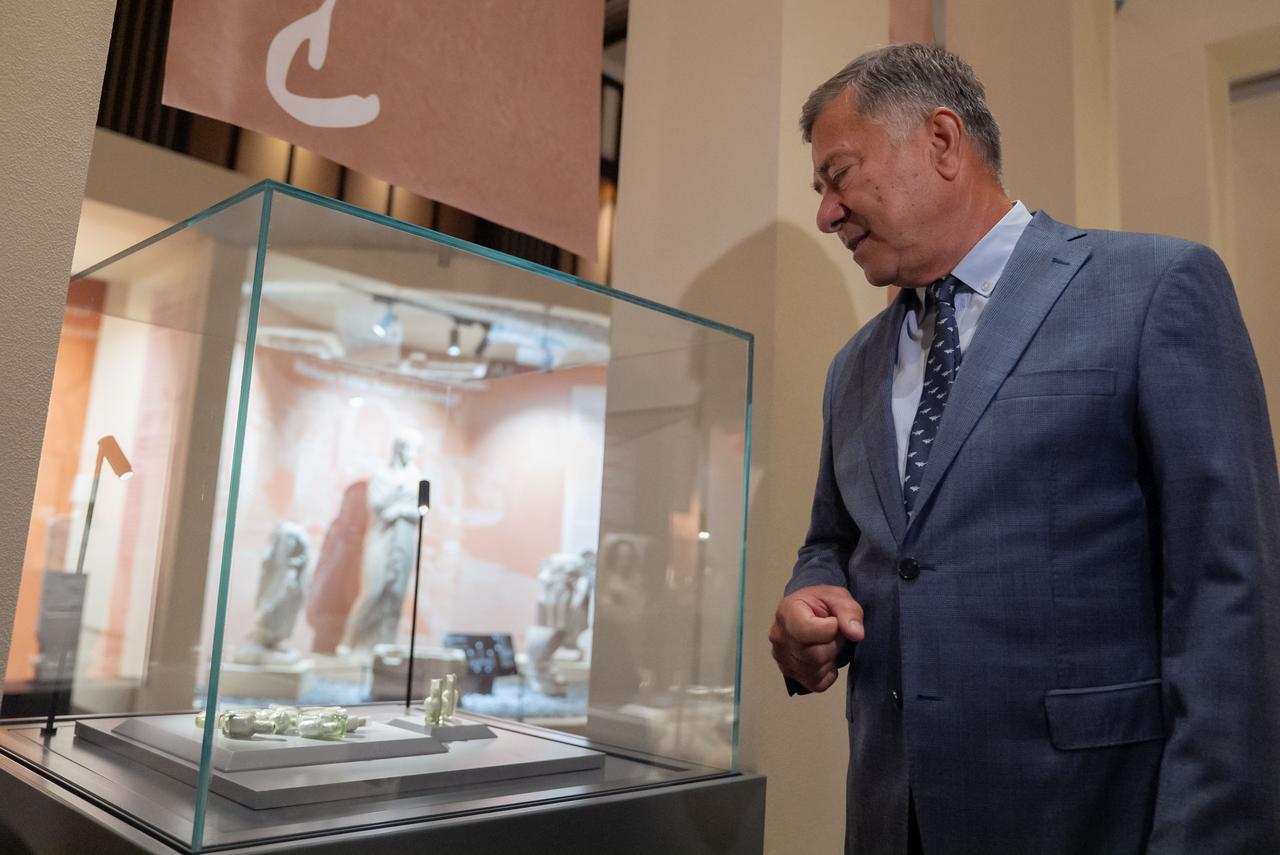 Associate Professor Hakan Oniz, Head of the Department of Conservation and Restoration of Cultural Properties at Akdeniz University and head of the excavation team, stated that glass perfume bottles dating back 1,000 to 1,100 years were uncovered in the wreck of a trade ship of Eastern Mediterranean origin during underwater archaeological excavations off the coast of Kas, at the Golden Age of Archaeology Exhibition in the Presidential Library, Ankara, Türkiye, August 8, 2025. (AA Photo)