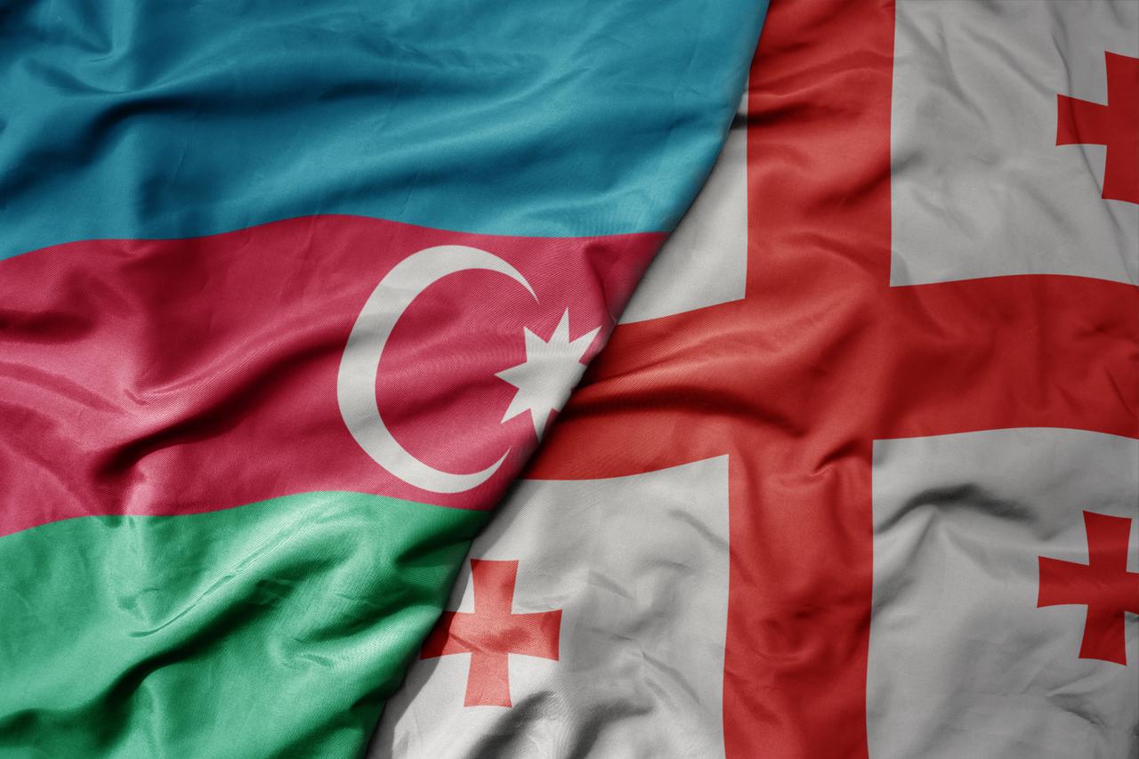 Waving national flag of Azerbaijan alongside national flag of Georgia, accessed on Aug. 8, 2025. (Adobe Stock Photo)