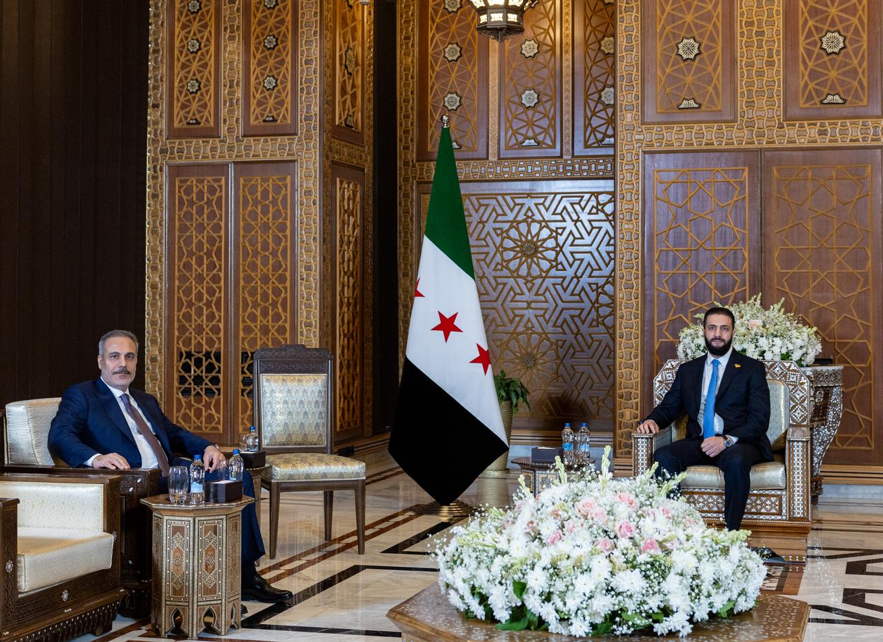 Foreign Minister Hakan Fidan (L) is received by Syrian President Ahmad al-Sharaa (R) in Damascus, Syria on August 07, 2025. (AA Photo)