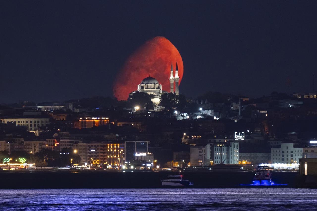 The Waxing Gibbous Moon rises over the sky as Beyazit Mosque is seen alongside in Istanbul, Türkiye on August 4, 2025. (AA Photo)