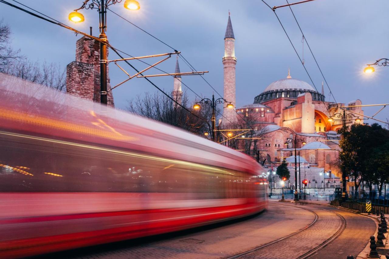 A T1 tram passes the Hagia Sophia museum at dusk, Istanbul, Türkiye, January 9, 2020. (AA Photo)