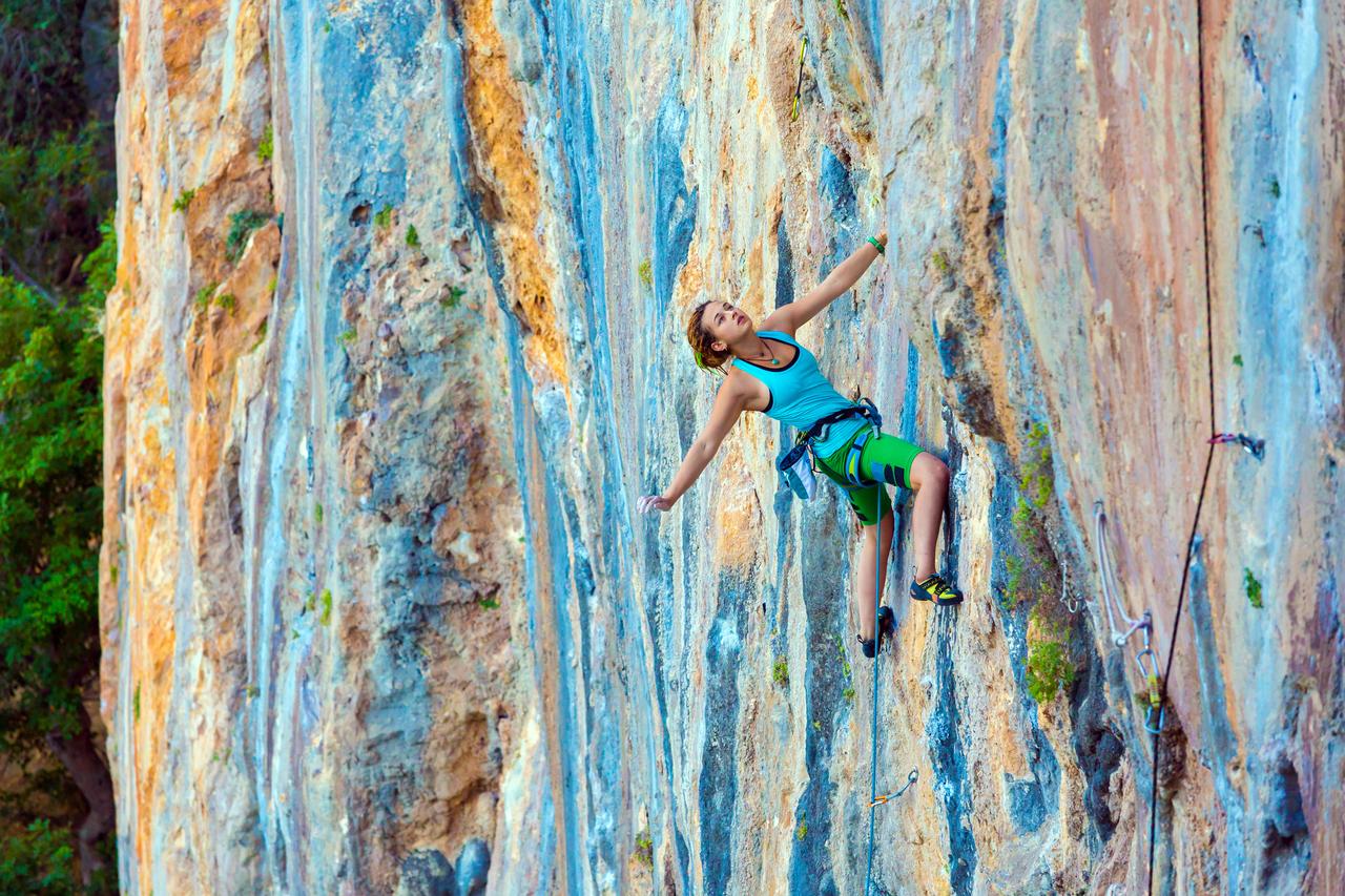A young woman climbs Mount Olympos, a climber-favorite destination in the Mediterranean, Antalya, Türkiye, accessed August 9, 2025. (Adobe Stock Photo)