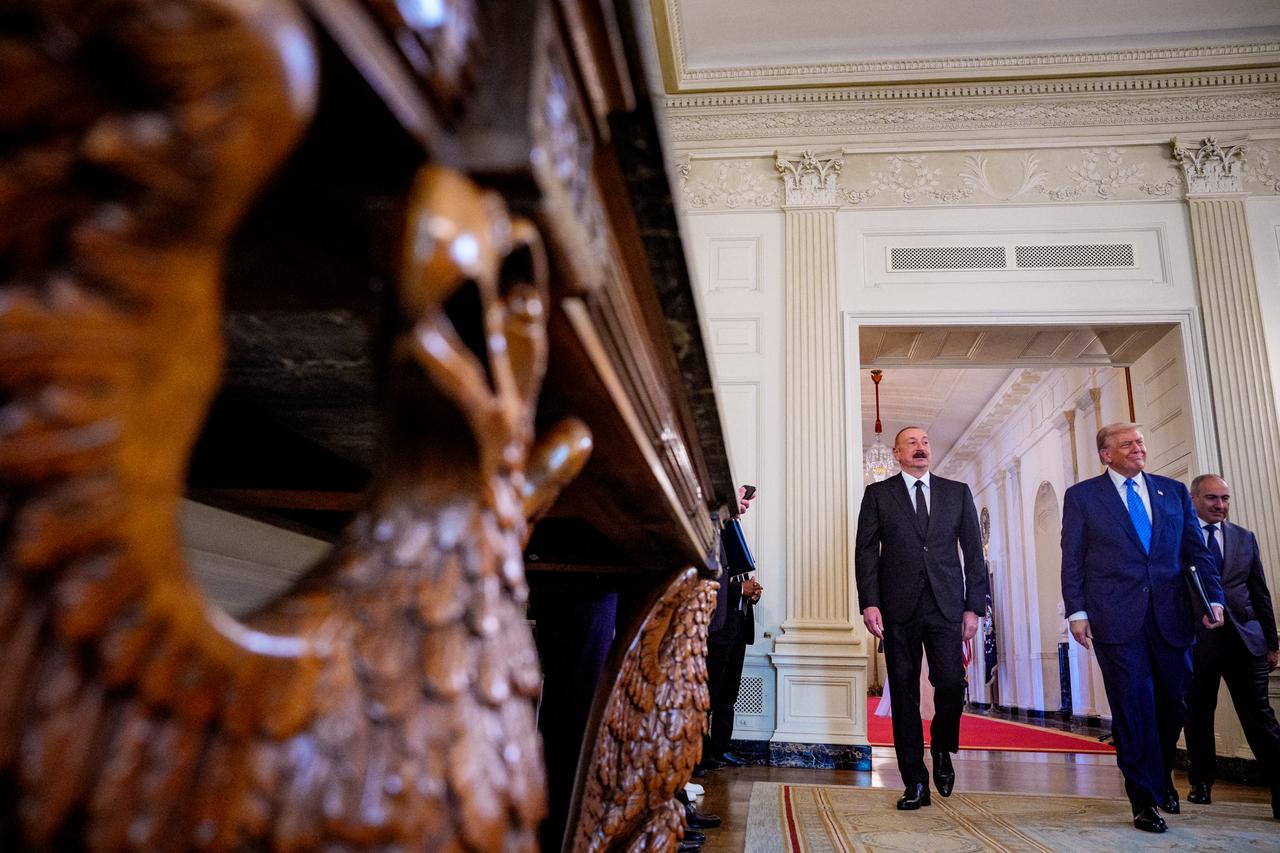U.S. President Donald Trump (2nd-R) arrives at a signing ceremony with Azerbaijani President Ilham Aliyev (L) and Armenian Prime Minister Nikol Pashinyan (R) in the State Dining Room of the White House in Washington, U.S. on August 8, 2025. (Photo by Andrew Harnik / Getty Images North America/ Getty Images via AFP)