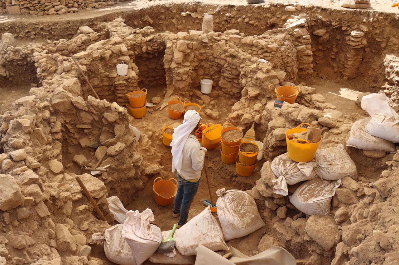 Archaeologists work inside the Neolithic settlement of Sayburc, where more than 50 structures linked to the Gobeklitepe culture have been unearthed during excavations in Sanliurfa, southeastern Türkiye, Sept. 1, 2025. (AA Photo)