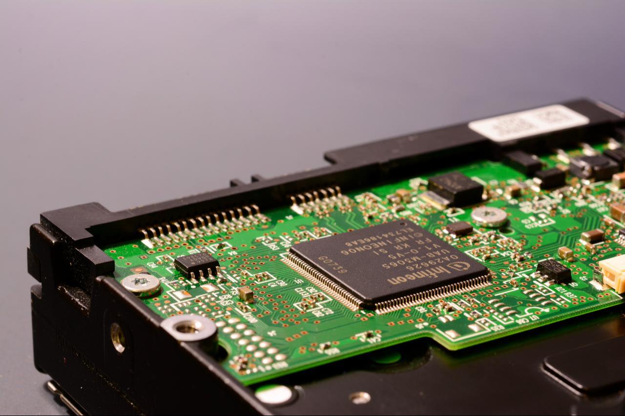 Close-up view of the internal circuitry of a hard disk with INFINEON chips, February 25, 2025. (Adobe Stock Photo)