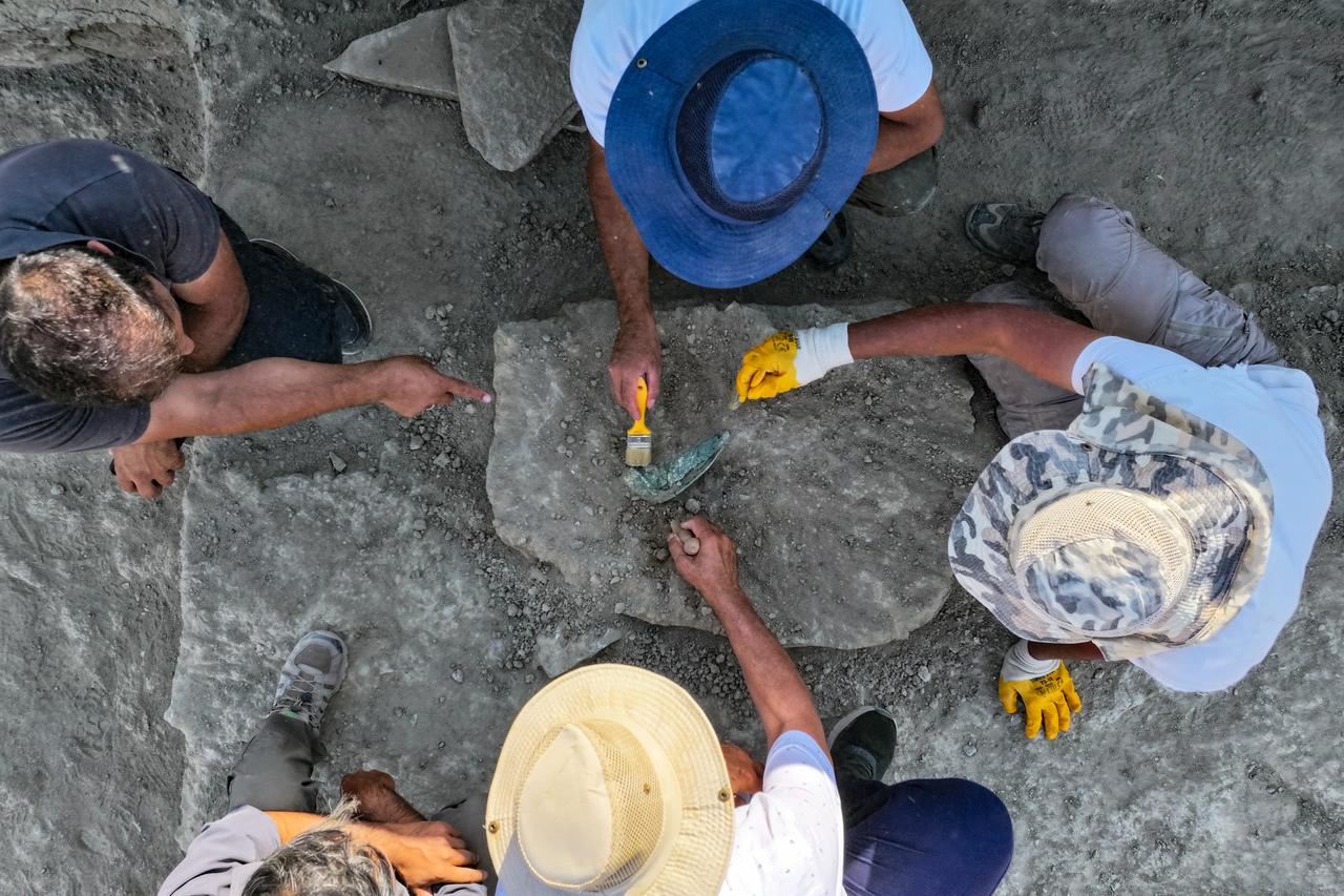 Archaeologists work to unearth sling stones used in ancient wars during ongoing excavations at Cavustepe Castle, built by Urartian King Sarduri II, in Gurpinar district of Van, Türkiye, Aug. 28, 2025. (AA Photo)