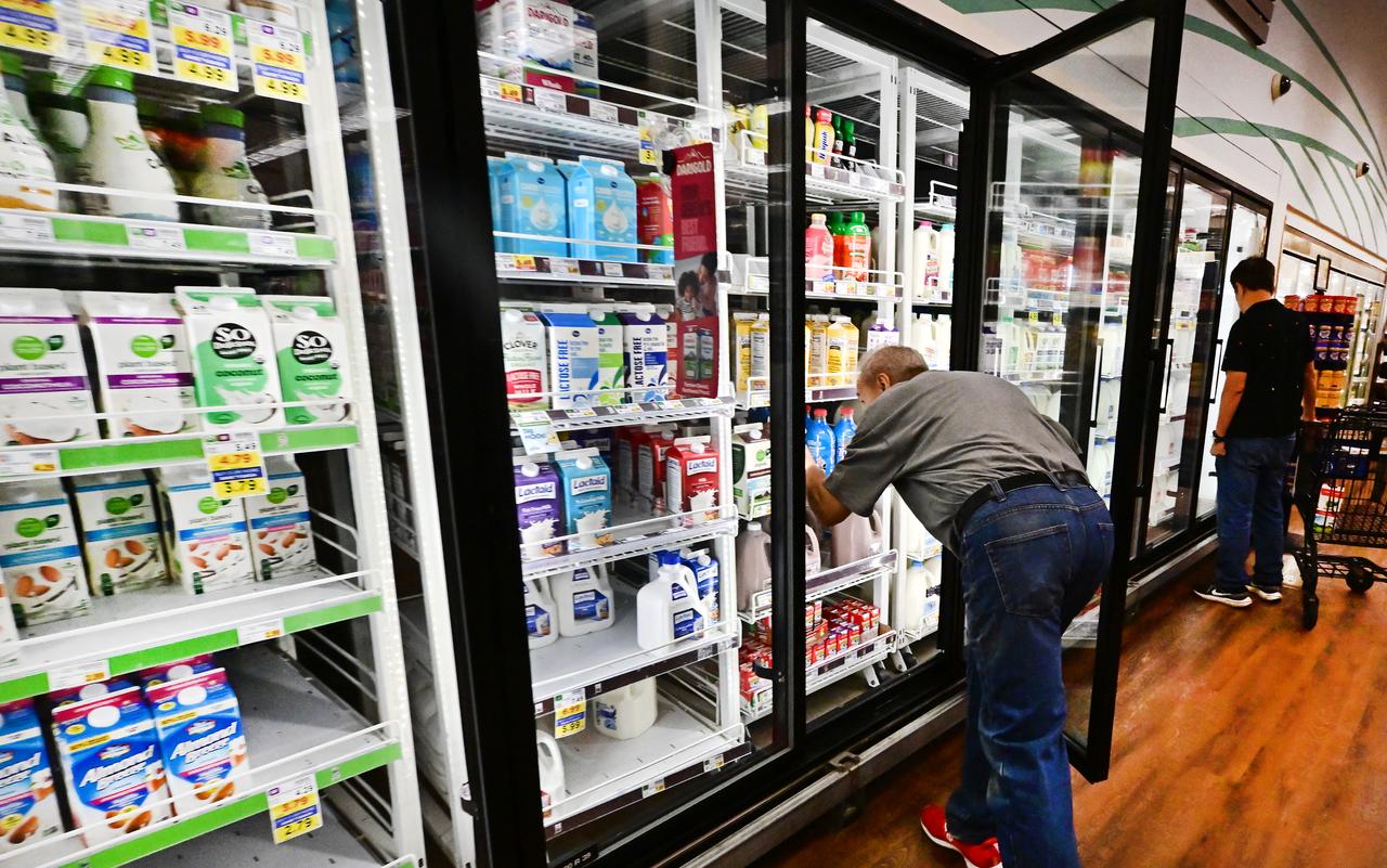 People shop for dairy products at a supermarket in Monterey Park, California, September 9, 2025. (AFP Photo)