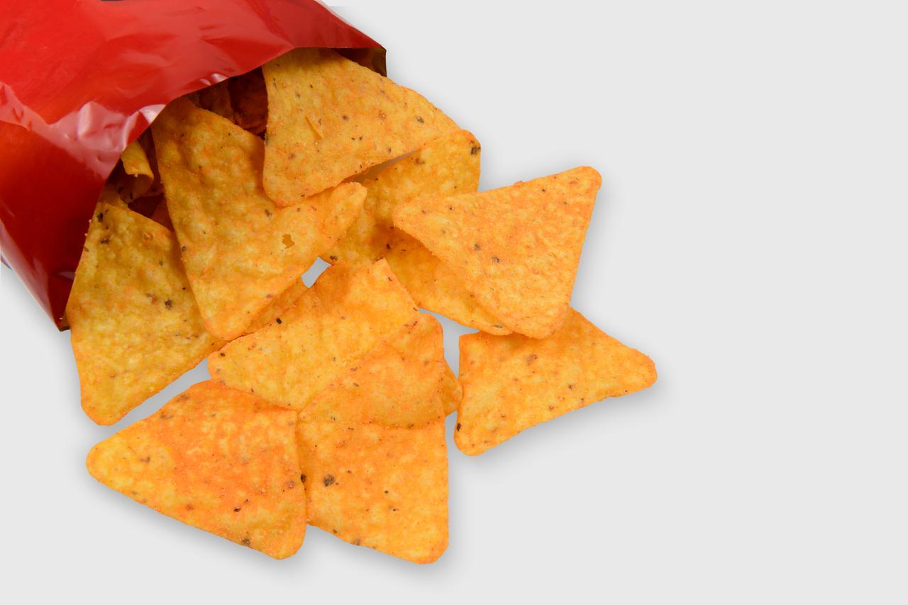 A bag of crisps, representing the prevalence of ultra-processed foods in children’s diets. (Adobe Stock Photo)