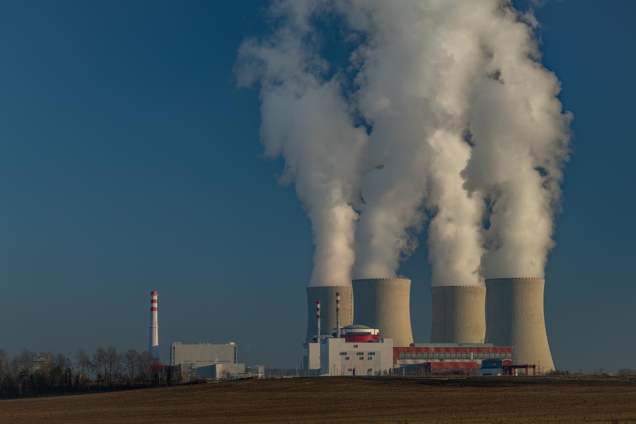 Big chimneys with white smoke on a sunny winter day near a nuclear power plant in Temelin, Czech Republic, 2 April 2025. (Adobe Stock Photo)