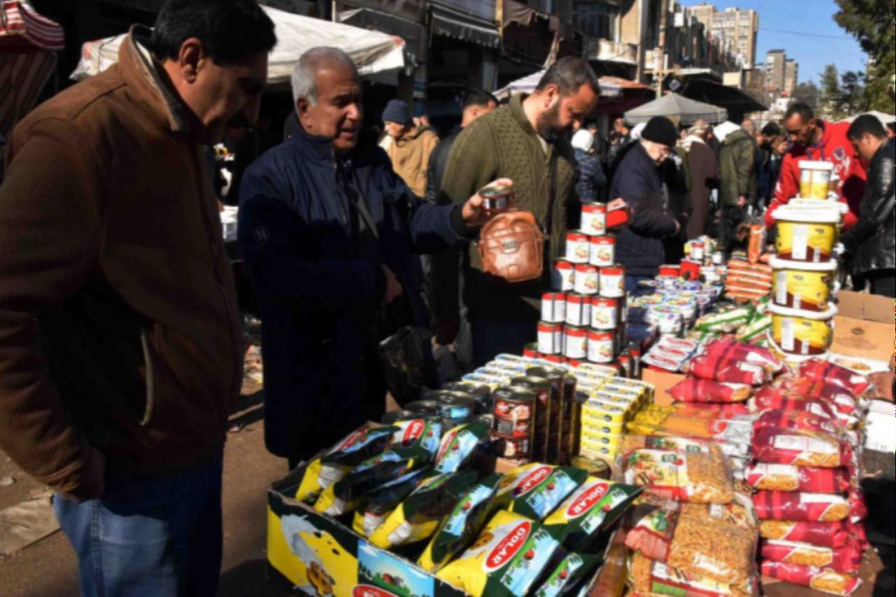 Photo from syrian street markets  showing people buying and there are turkish good . ( Photo courtesy of Tarek Al-Husseina )