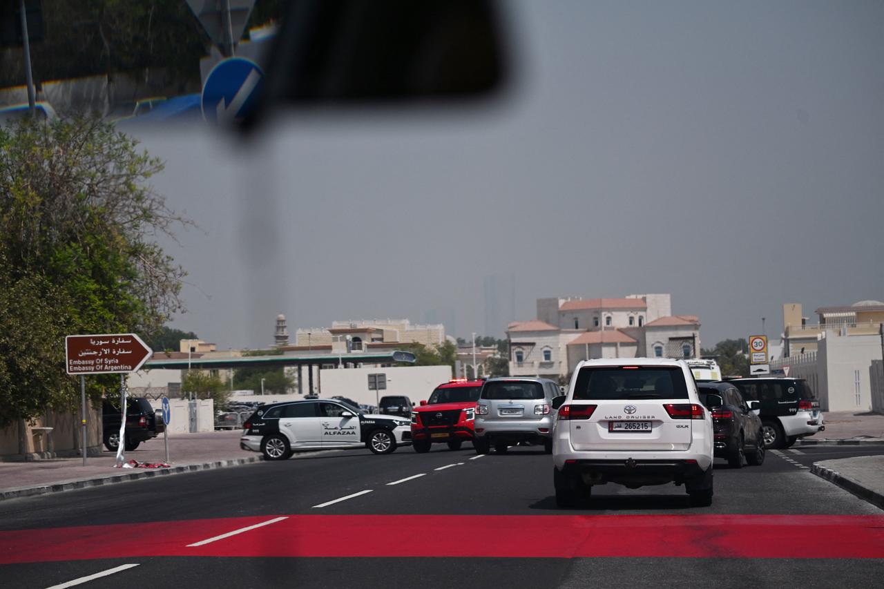 Police cars block traffic at the entrance of the district where residential buildings housing members of Hamas' political bureau were targeted, Sept. 10, 2025. (AFP Photo)