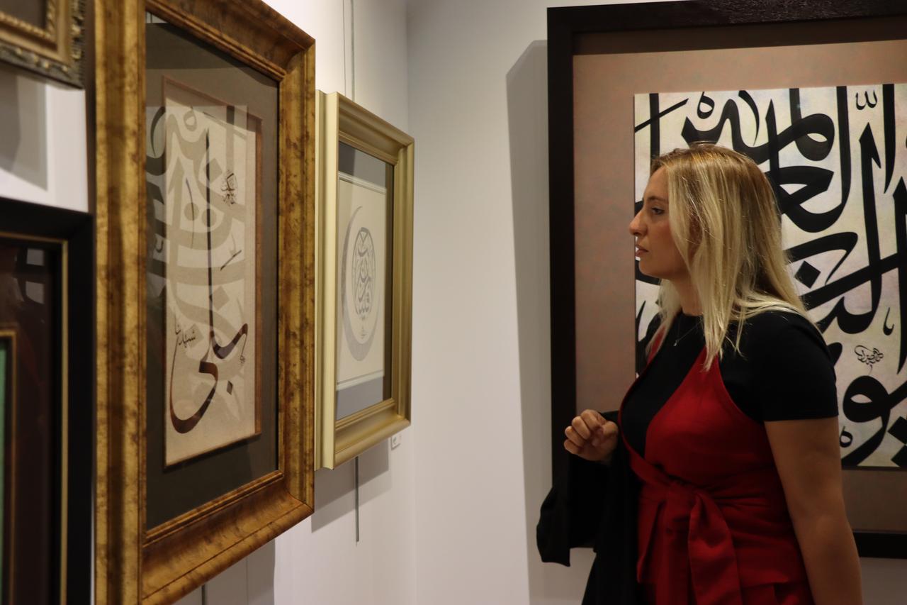 A visitor looks at calligraphy works at the “Goodness for Gaza” exhibition at Dolmabahce Art Gallery in Istanbul, Türkiye, September 10, 2025. (AA Photo)