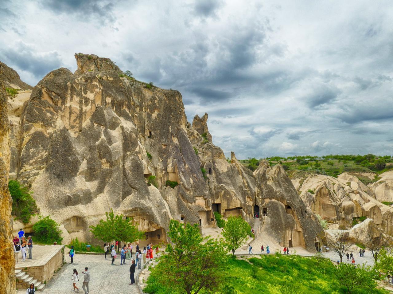 Tourists visiting Goreme Open Air Museum with its rock formations and cave churches, Nevsehir, Türkiye, accessed September 11, 2025. (Adobe Stock Photo)